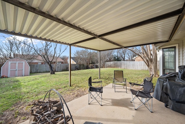 view of patio / terrace featuring area for grilling and a shed