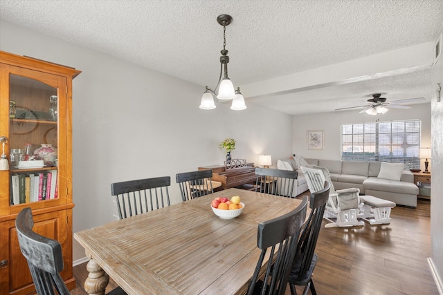 dining area with hardwood / wood-style flooring, a textured ceiling, and ceiling fan