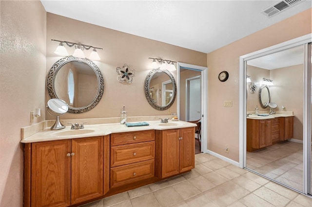 bathroom with vanity and tile patterned floors