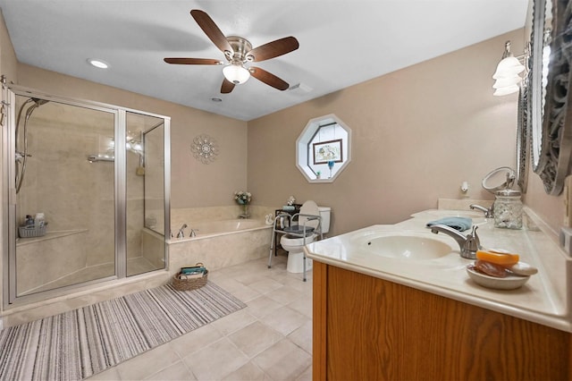 full bathroom with plus walk in shower, tile patterned flooring, vanity, ceiling fan, and toilet