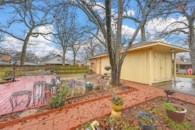 view of yard featuring a storage shed and a patio