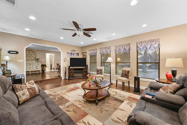 living room with hardwood / wood-style floors and ceiling fan