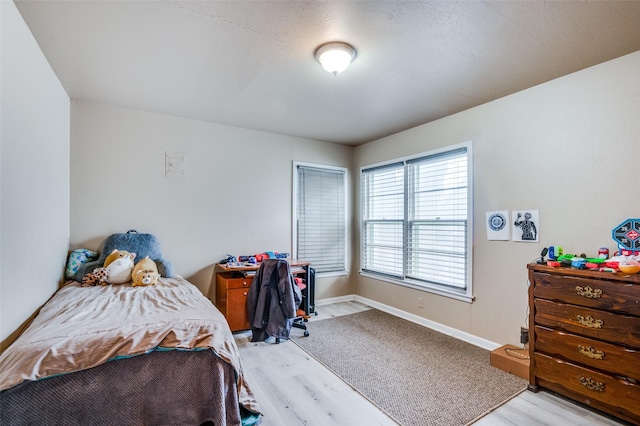 bedroom with light hardwood / wood-style flooring