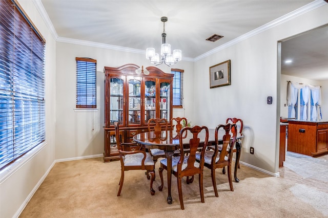 carpeted dining area featuring crown molding and an inviting chandelier