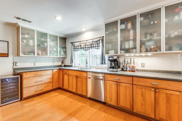 bar with dishwasher, crown molding, beverage cooler, and a sink
