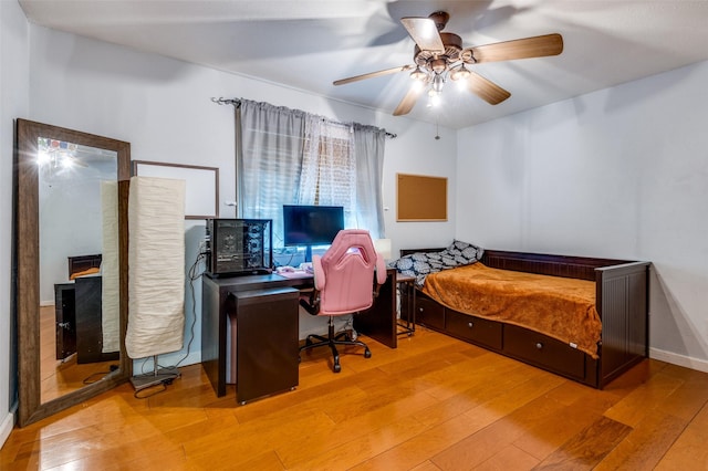 bedroom featuring ceiling fan and light hardwood / wood-style floors