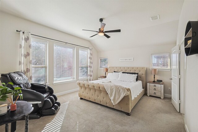 carpeted bedroom featuring vaulted ceiling and ceiling fan