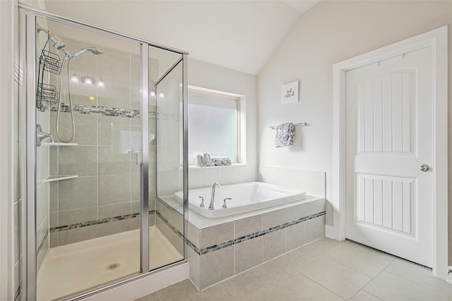 bathroom with tile patterned flooring, vaulted ceiling, and plus walk in shower