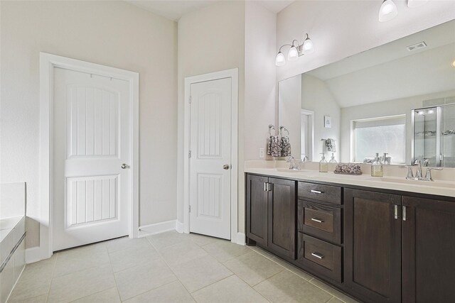 bathroom featuring vaulted ceiling, separate shower and tub, and tile patterned flooring