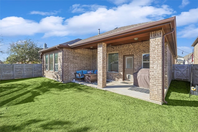 back of property with a lawn and a patio area