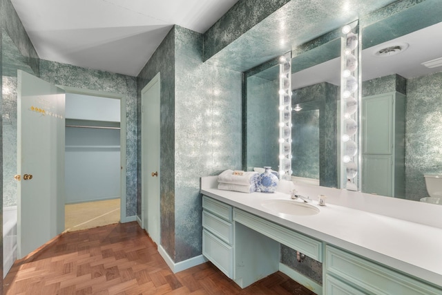 bathroom featuring vanity and parquet floors