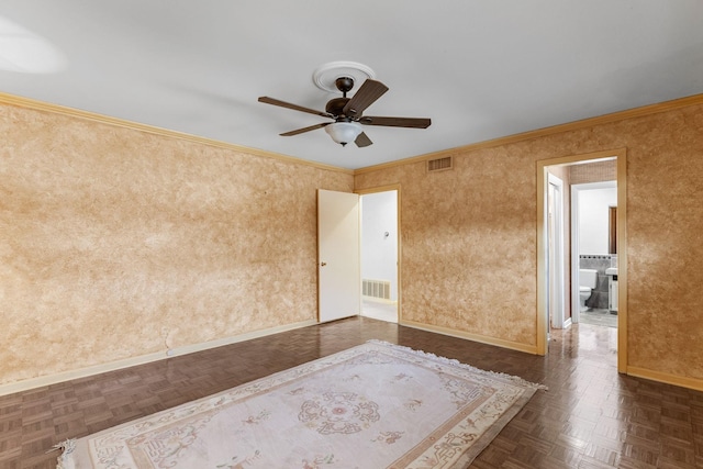 unfurnished room with ceiling fan, ornamental molding, and dark parquet flooring