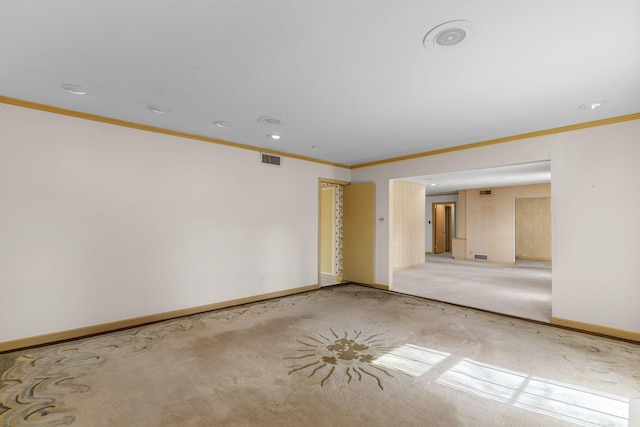 empty room with crown molding and carpet