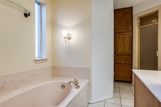 bathroom featuring vanity, tile patterned flooring, and separate shower and tub