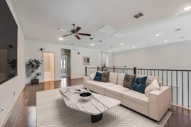 living room with hardwood / wood-style floors and ceiling fan