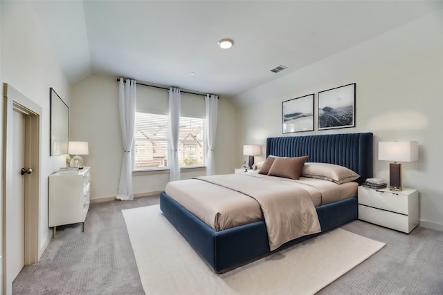 carpeted bedroom featuring vaulted ceiling