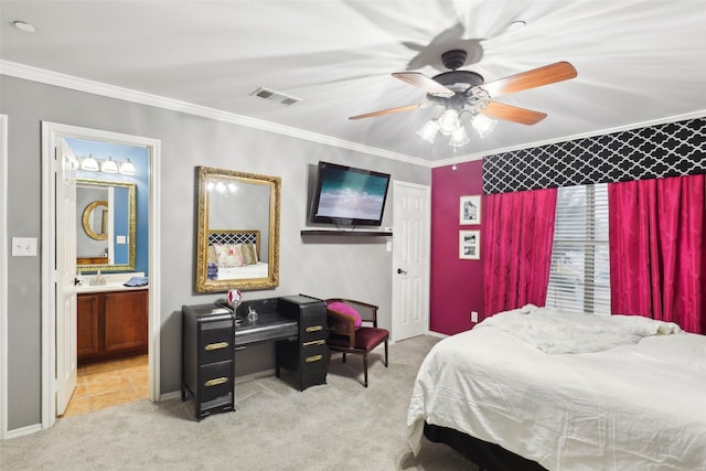 bedroom featuring sink, crown molding, ensuite bath, ceiling fan, and light colored carpet