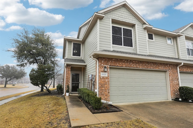 townhome / multi-family property featuring a garage