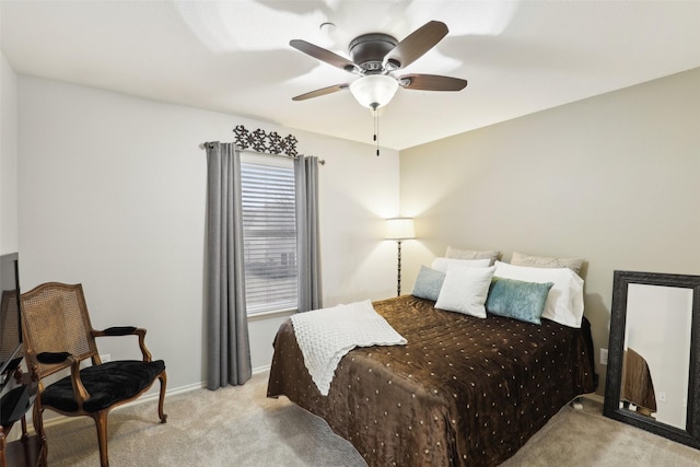 bedroom featuring light colored carpet and ceiling fan