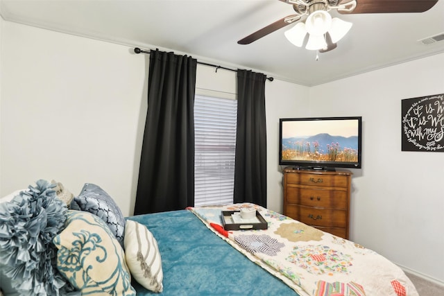 bedroom with crown molding and ceiling fan