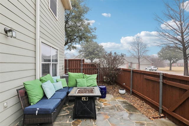 view of patio / terrace with an outdoor living space with a fire pit