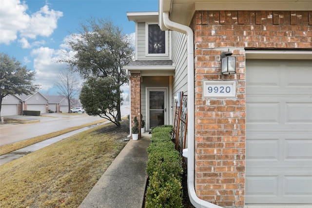 view of exterior entry with a garage