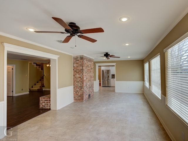 spare room with light tile patterned floors and ornamental molding