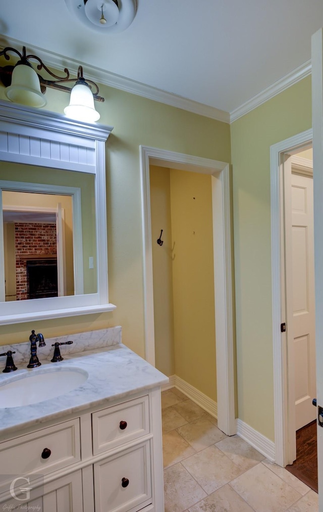 bathroom featuring crown molding and vanity