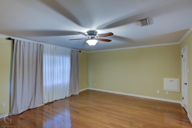 spare room featuring crown molding, ceiling fan, and light hardwood / wood-style floors