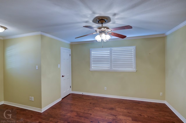 spare room featuring dark wood-type flooring, ornamental molding, and ceiling fan