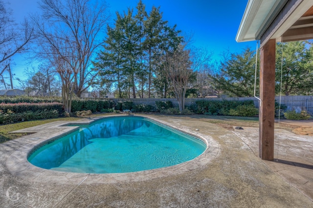 view of swimming pool with a patio