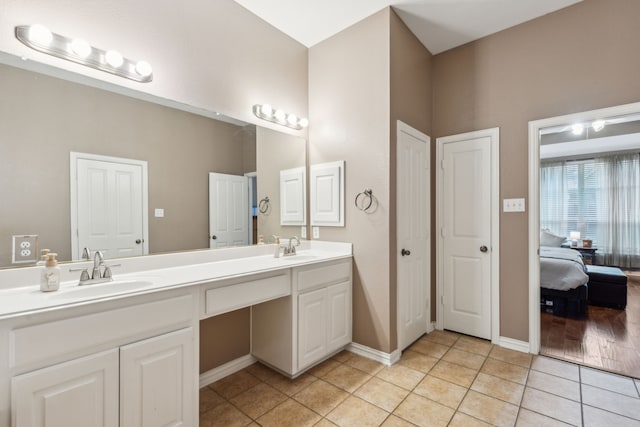 bathroom featuring tile patterned flooring and vanity