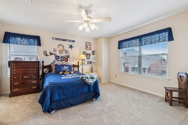 bedroom featuring ceiling fan and carpet