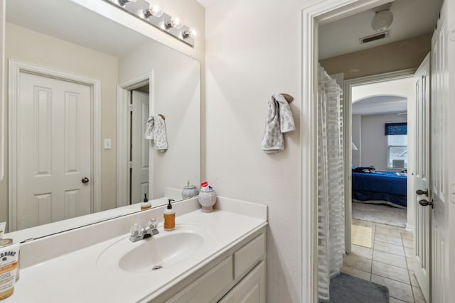 bathroom with tile patterned flooring and vanity