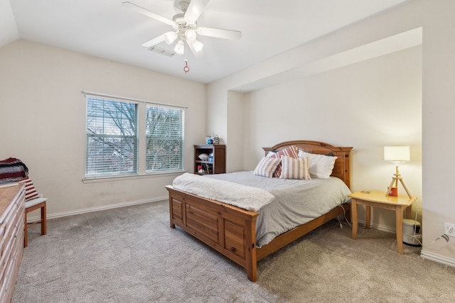 carpeted bedroom with lofted ceiling and ceiling fan