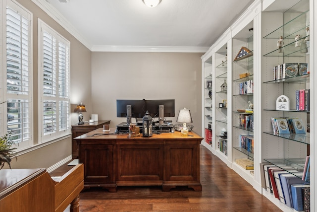 office area with ornamental molding, plenty of natural light, dark hardwood / wood-style floors, and built in features