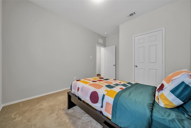 bedroom with light colored carpet