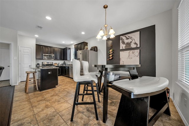 dining area featuring a notable chandelier and plenty of natural light