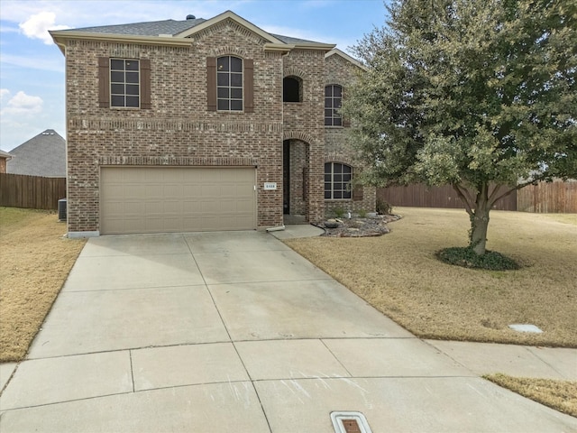 view of front of home with a garage and a front yard