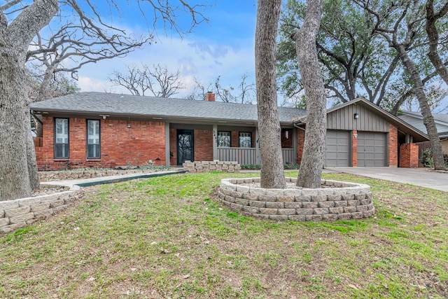 ranch-style home featuring a garage and a front yard