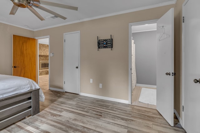 bedroom featuring ceiling fan, ornamental molding, ensuite bathroom, and light hardwood / wood-style floors