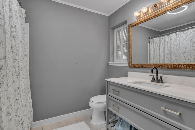 bathroom featuring crown molding, vanity, toilet, and tile patterned flooring