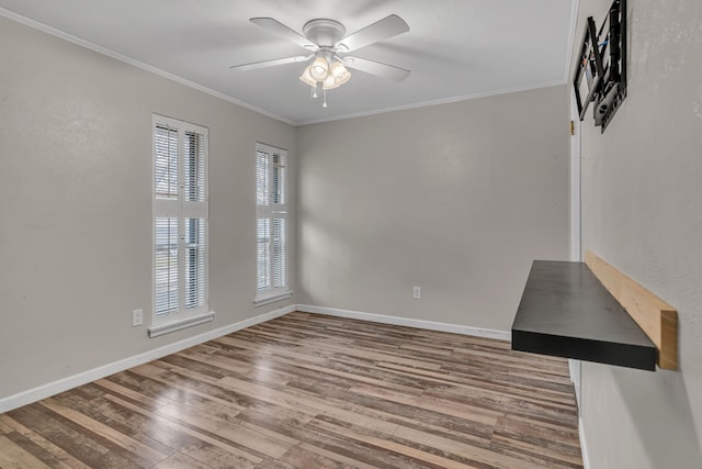 unfurnished room featuring wood-type flooring, ornamental molding, and ceiling fan