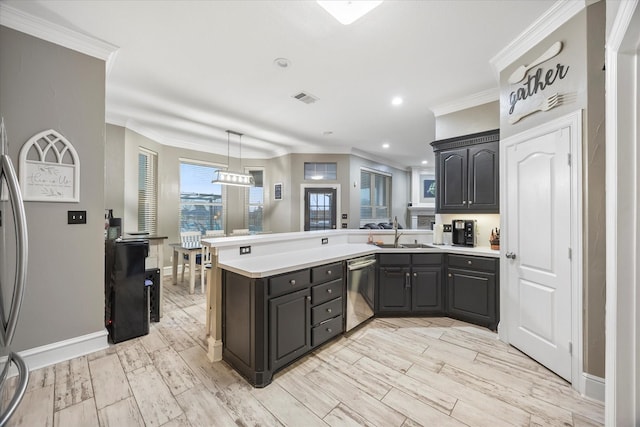 kitchen featuring dishwasher, light hardwood / wood-style flooring, and kitchen peninsula