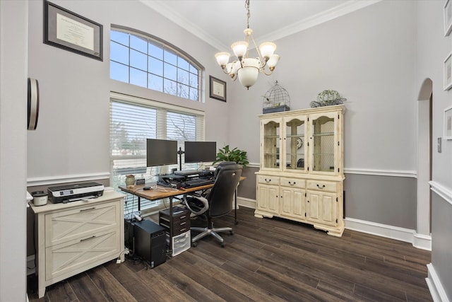 home office featuring crown molding, a towering ceiling, dark hardwood / wood-style floors, and a notable chandelier