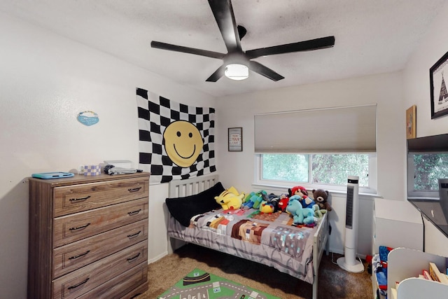 carpeted bedroom with ceiling fan