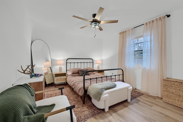 bedroom with ceiling fan and light wood-type flooring