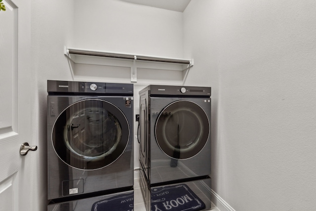 clothes washing area with separate washer and dryer