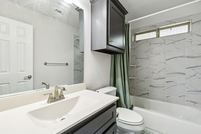 full bathroom featuring vanity, shower / bath combination with curtain, and toilet