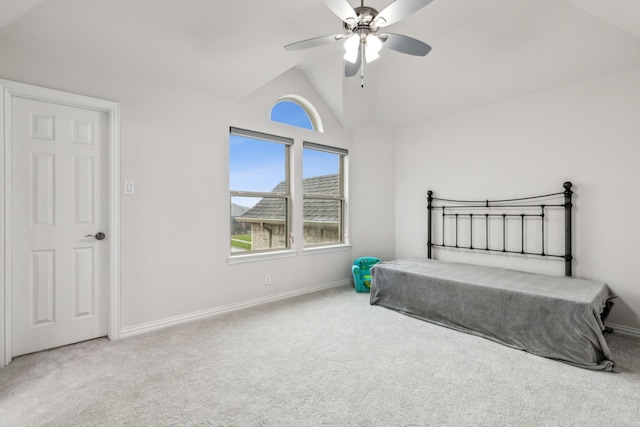 carpeted bedroom featuring vaulted ceiling and ceiling fan